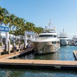 Luxury superyachts docked along the floating marina at the Fort Lauderdale International Boat Show 2026 in the Superyacht Village at Pier 66