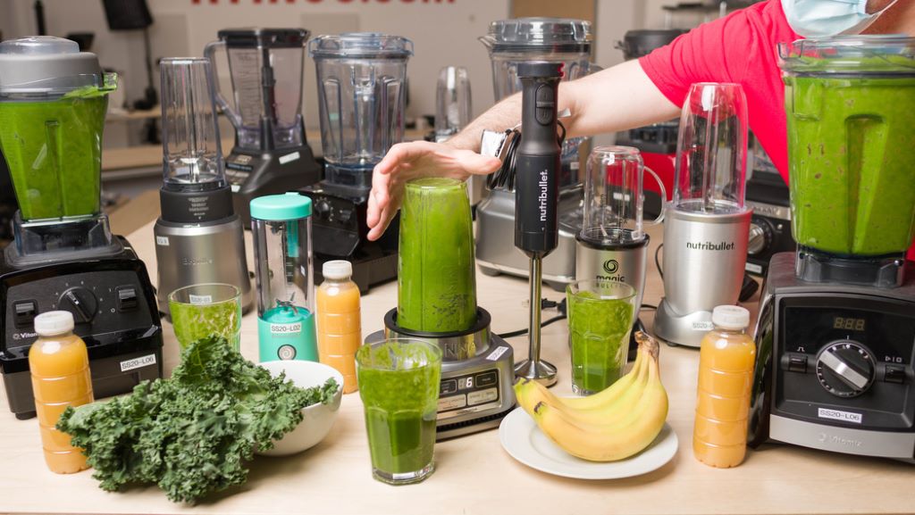 Budget blender crushing ice and blending fresh fruit into a smooth smoothie.
