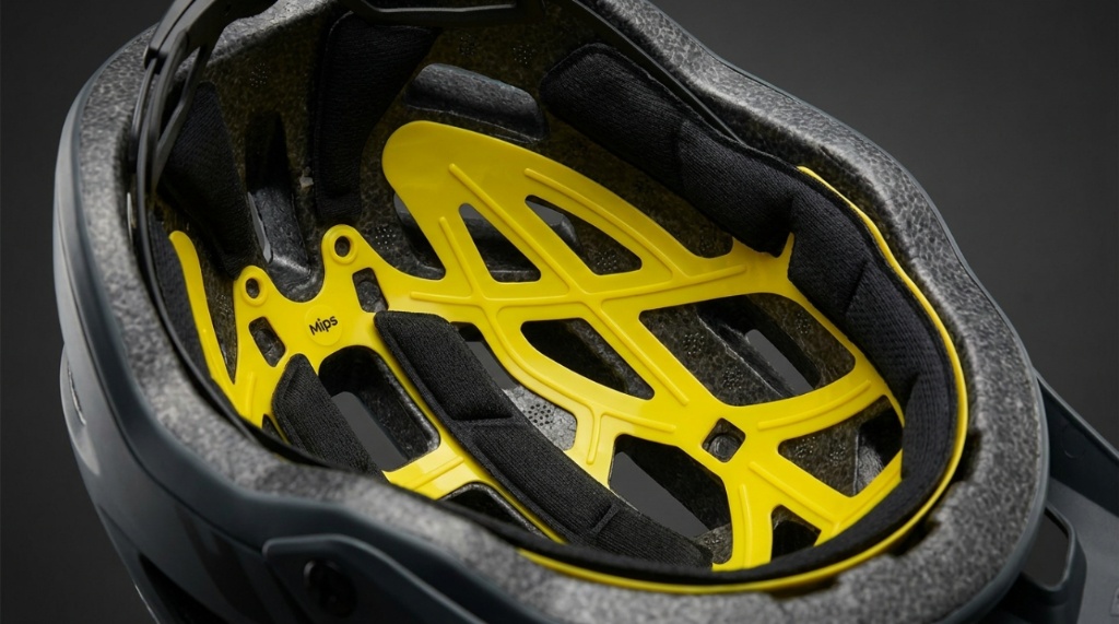 Close up of the yellow rotational protection liner inside a bike helmet.