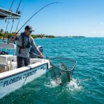 Angler holding a landing net with a fish caught in Florida waters