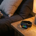 Person wearing a modern health tracking watch displaying daily activity metrics.
