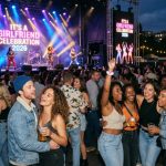 Couples and friends enjoying live performances at It's a Girlfriend Celebration 2026