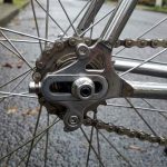 Rear wheel bike trailer coupler attached near bicycle axle on Portland hill