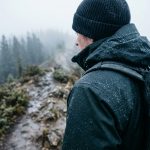 Stay comfortable in freezing rain and slush. Learn essential layering rules, smart fabric choices, and packing hacks to keep you warm and dry outdoors.